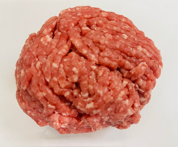 Ball of ground meat on a white background